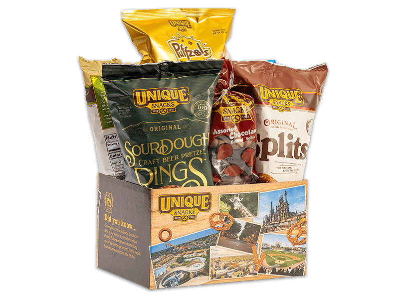 Lehigh basket box with a light wood pattern, varied pictures of unique snacks factories and buildings, different kinds of pretzels surrounding it, and the unique snacks logo in the upper lefthand corner, filled with various Unique Snacks products