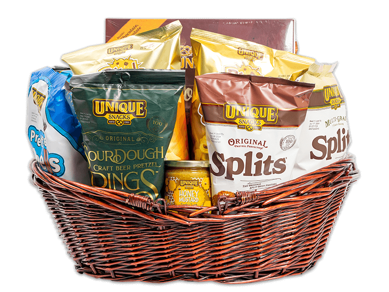 Large, woven, dark brown basket filled with various Unique Snacks products