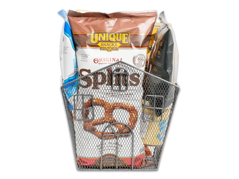 Black metal wire basket shaped like a house filled with various Unique Snacks products