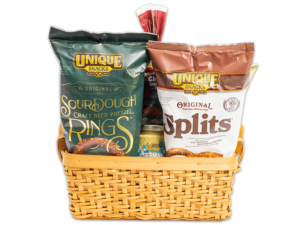 varied unique snacks products in a light washed medium sized woven basket