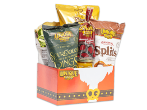 Santa belt basket box filled with various Unique Snacks products
