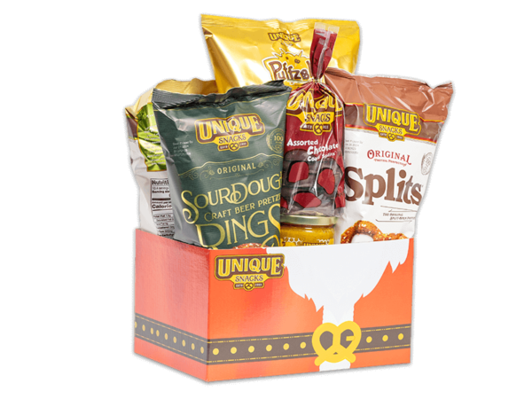 Santa belt basket box filled with various Unique Snacks products