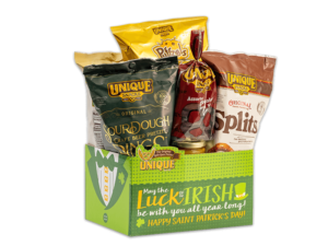 St Patricks Day basket box, green tuxedo on side with text, "Luck of the Irish" on box filled with various Unique Snacks products