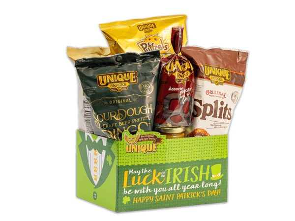St Patricks Day basket box, green tuxedo on side with text, "Luck of the Irish" on box filled with various Unique Snacks products