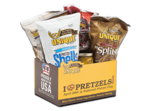 National pretzel day basket box, text, "April 26th is National Pretzel Day" on box filled with various Unique Snacks products