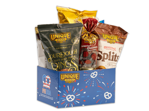 Patriotic pretzel basket that has pretzel fireworks in red white and blue on it, filled with various Unique Snacks products