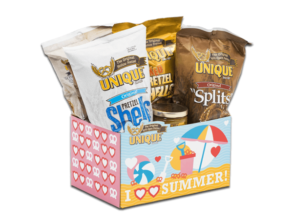 Summer basket box, with ocean and beach equipment, pretzel and hearts pattern on box filled with various Unique Snacks products