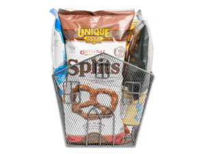 varied unique snacks products in a black metal woven basket shaped like a house