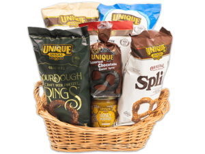 Oval wash light woven basket filled with various Unique Snacks products
