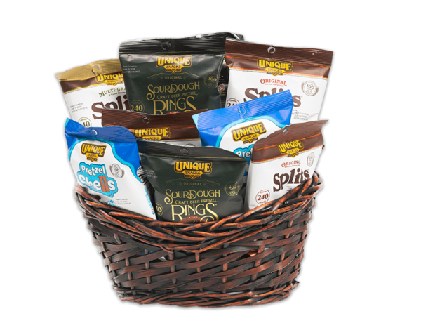 Snack basket, a dark woven basket, filled with various Unique Snacks snack sized products