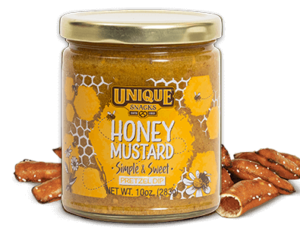 Unique snacks honey mustard pretzel dip in a jar with honey comb decorative art on it