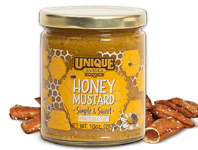 Unique snacks honey mustard pretzel dip in a jar with honey comb decorative art on it