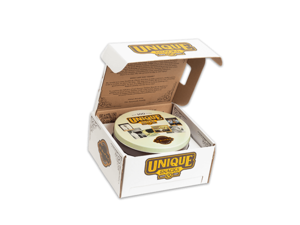 unique snacks tin inside a white box with unique snacks logo on it