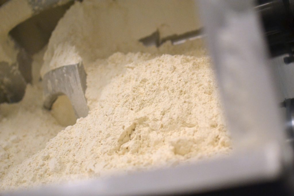 A mixer full of raw flour