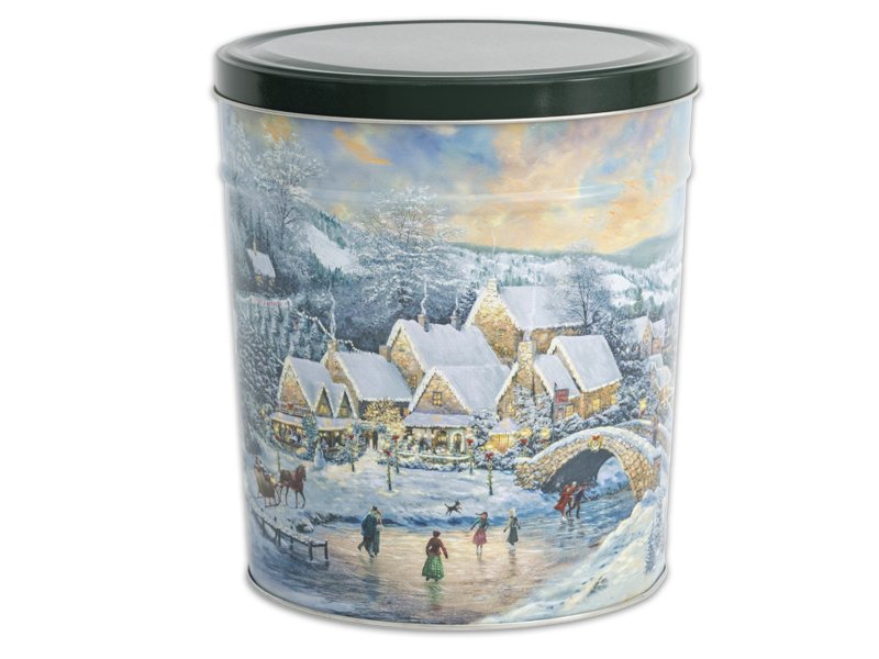 Christmas at Lamplight Village Tin Image of a village and Ice skating.