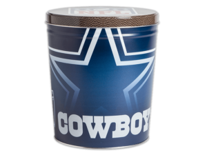 Dallas Cowboys pretzel tin, fade logo faded into dark blue background, "Cowboys" text in foreground, NFL logo over football texture pattern on lid