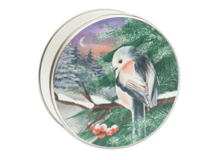 Winter Songbird 24-count tin, a white, red, and black bird sitting on a snowy, pine tree branch