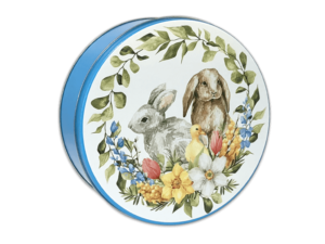 A tin can with a blue body and a hits lid that has a green wreath going around and white blue yellow and light red flowers at the bottom. A duck a grey and brown bunny sitting in the middle of the wreath.