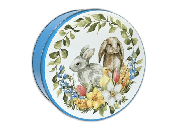 Springtime Friends 24-count tin with a blue body and a hits lid that has a green wreath going around and white blue yellow and light red flowers at the bottom. A duck a grey and brown bunny sitting in the middle of the wreath.